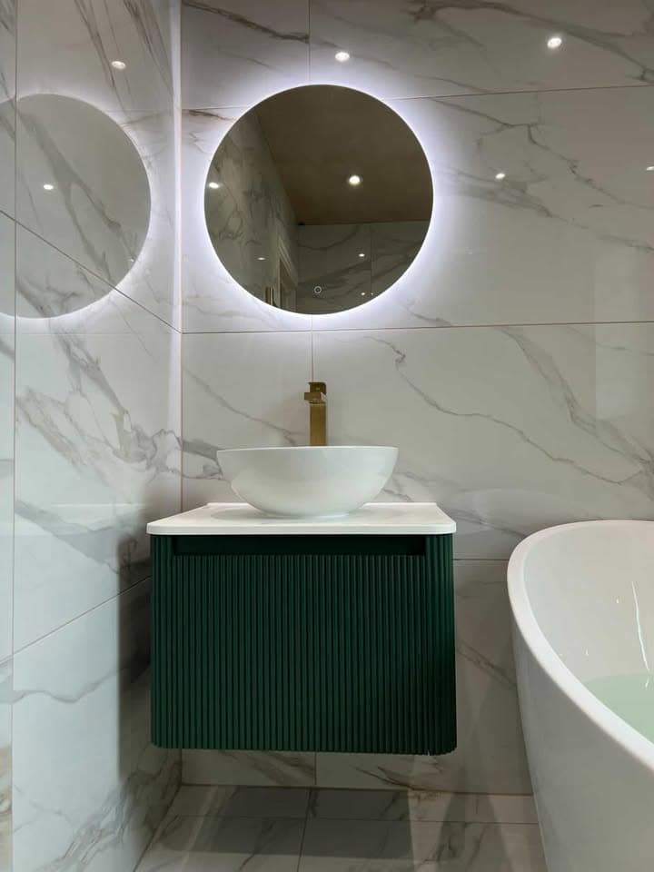 Compact bathroom project with fitted shower area and tidy tiled finish