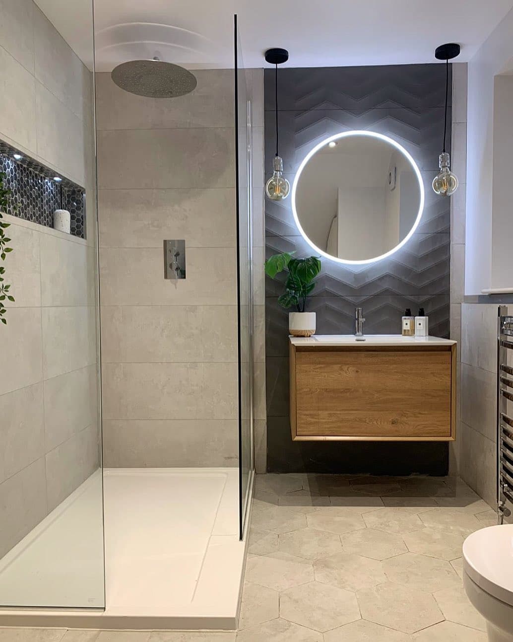 Premium shower and bathroom finish showing careful tile setting and fitted details
