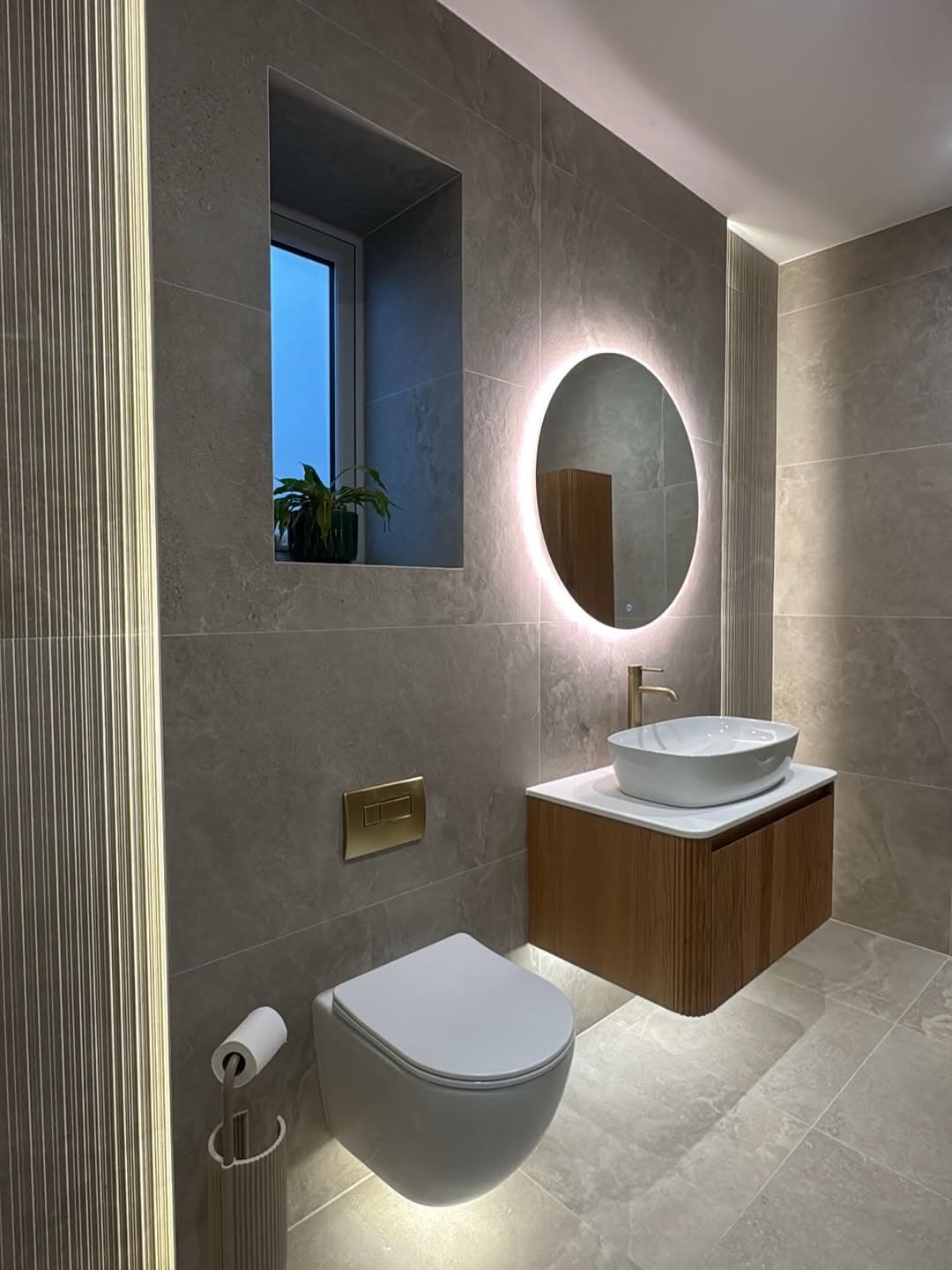 Bathroom renovation photo showing premium wall and floor finishes