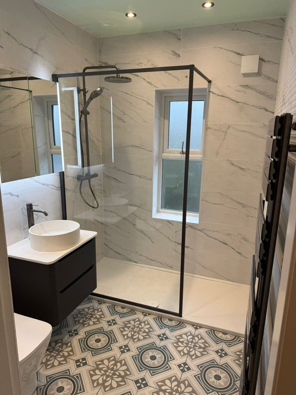 Finished bathroom photo showing coordinated tiling and bathroom fittings