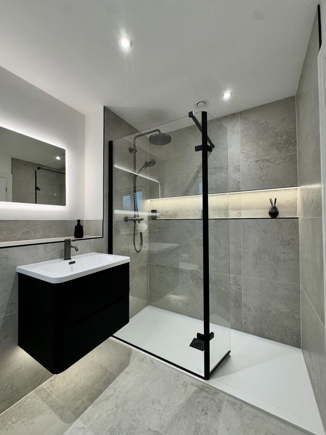 Finished bathroom with modern tile work and premium bathroom fittings