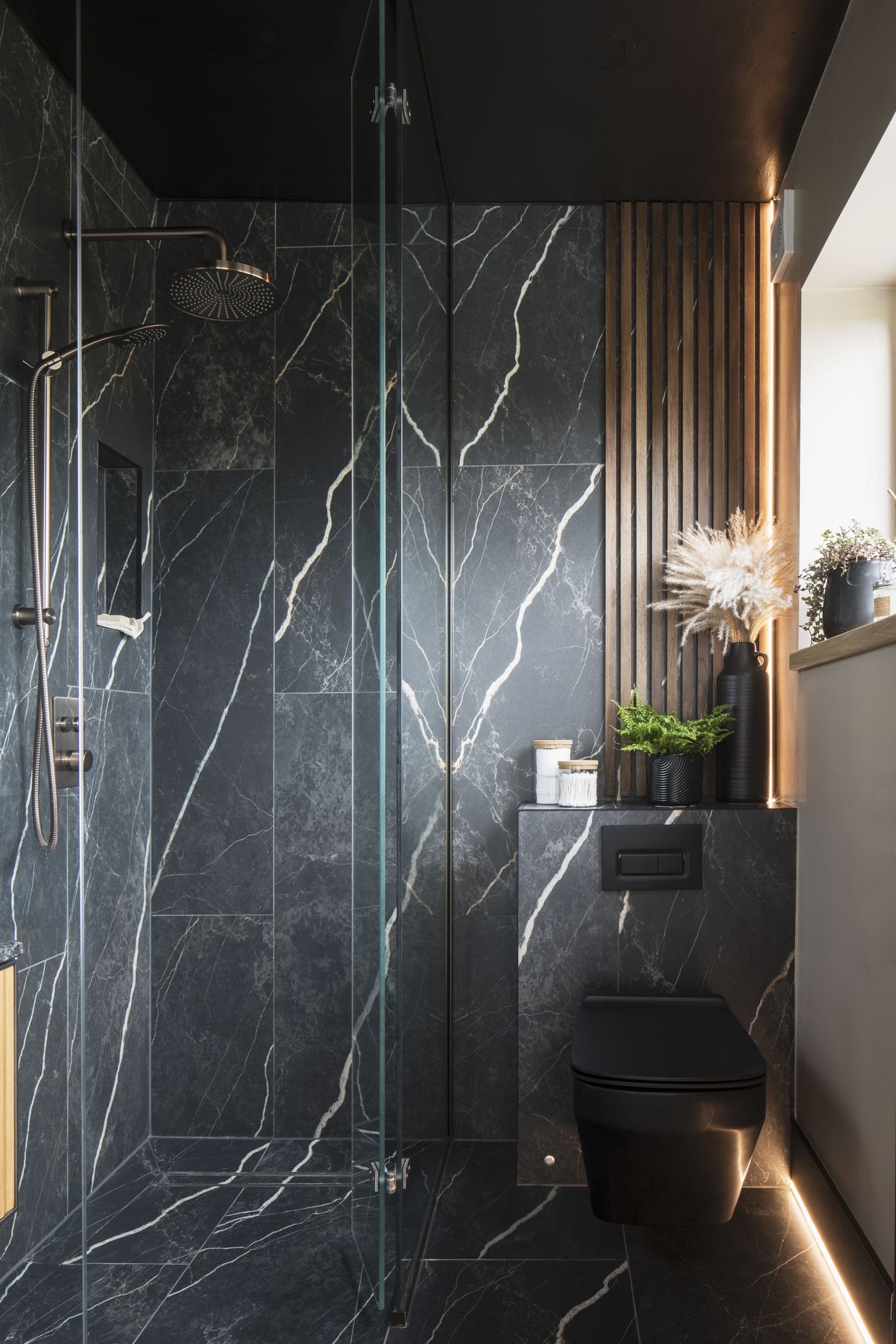 Full-height bathroom photo showing premium renovation finish and bathroom fixtures