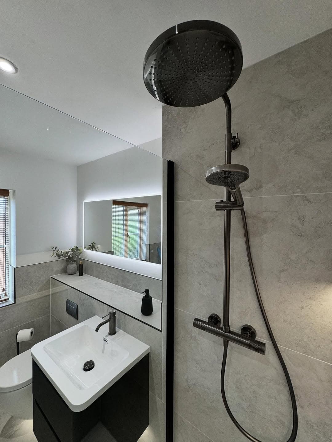 Bathroom renovation photo showing tidy surfaces and coordinated bathroom finish